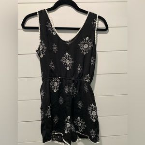 Paper Doll, Girls size 12 Romper with white flowers and white trim accent.